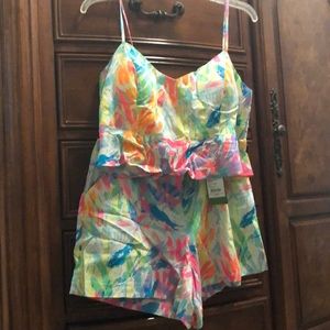 Crop top and high waisted shorts.